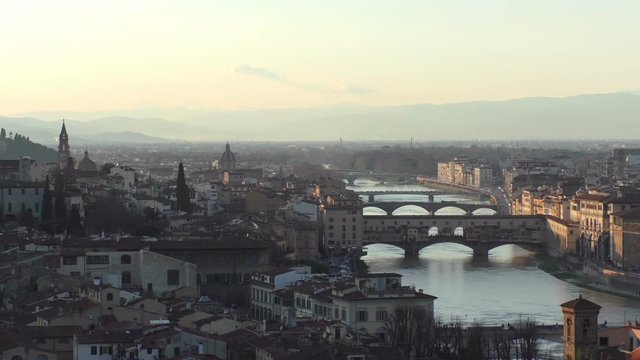 View of famous Ponte Vecchio and other bridges in the evening. Historical sight of Florence. Tuscany, Italy, Europe.