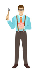 Businessman trying to break a piggy bank with a hammer
