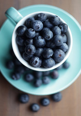 Blueberries in a turquoise mug