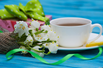 Spring breakfast hot tea and a bouquet of snowdrops