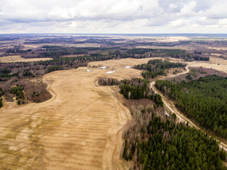 aerial view of rural area with fields and forests