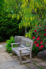 Park bench in a spring garden.