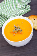 vegetable cream soup bowl on table