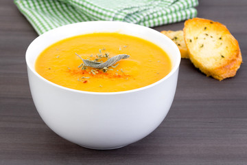 vegetable cream soup bowl on table