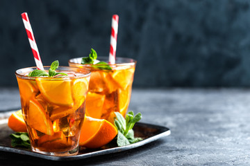 homemade flavored orange iced tea, refreshing summer beverage