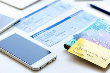 Credit cards with airline tickets for vacations on table background