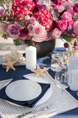 Table setting at a luxury wedding or another catered event. Marine themes