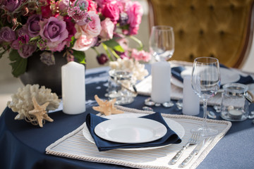Table setting at a luxury wedding or another catered event. Marine themes