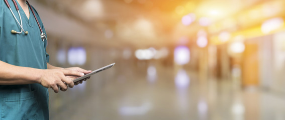 Medical and healthcare,Male doctor or medical students or surgeon,anesthesiologists using digital tablet during the conference,Health Check with digital system support for patient,background banner