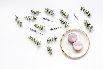 woman breakfast with lavander and eucalyptus on white table top view