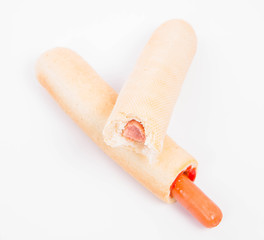 Hot dogs on a white background, one bitten