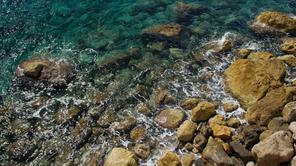 Sea Braking Against Stones On a Beach, Waves of Pure Water. Mediterranean Sea.