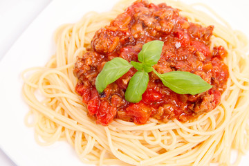 Spaghetti bolognese on a white background