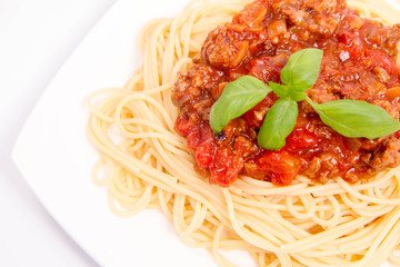 Spaghetti bolognese on a white background