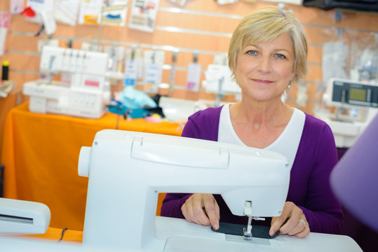 Portrait of senior lady at sewing machine