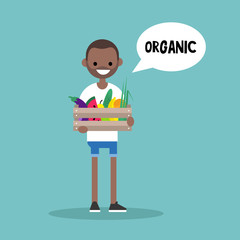 Young vegetarian black man holding a crate full of fruits and vegetables / editable flat vector illustration, clip art