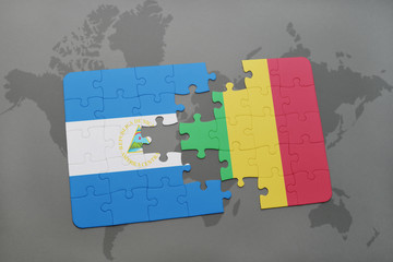 puzzle with the national flag of nicaragua and mali on a world map