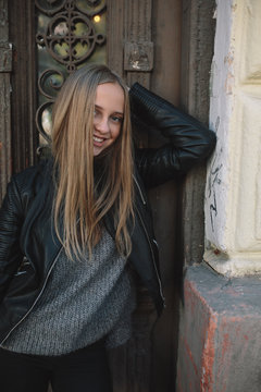 beautiful woman near the old doors