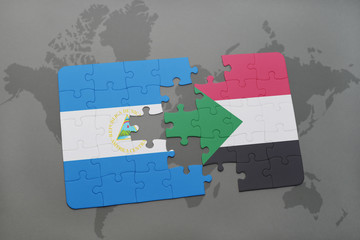 puzzle with the national flag of nicaragua and sudan on a world map