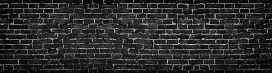 black brick wall, wide panorama as a backdrop