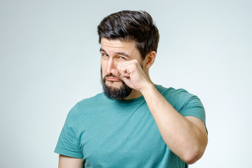 Obraz premium Portrait of man is crying isolated