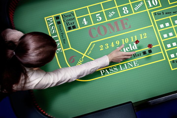 dice throw on craps table at casino - 141286412