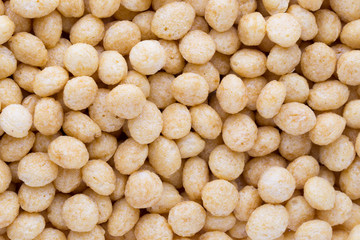 Corn flakes rings on the background.