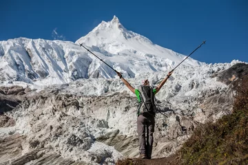 No drill roller blinds Manaslu Trekker in front of Manaslu glacier on Manaslu circuit trek in Nepal