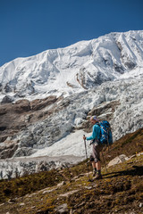 Fototapeta premium Trekker in front of Manaslu glacier on Manaslu circuit trek in Nepal