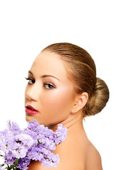 Naklejka premium Sensual young spa woman holding flower.