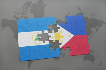 puzzle with the national flag of nicaragua and philippines on a world map