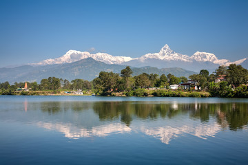 View at Annapurna mountain range and its reflection in Phewa lake in Pokhara, Nepal