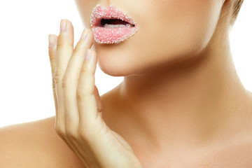Obraz na płótnie Canvas Female lips with sugar