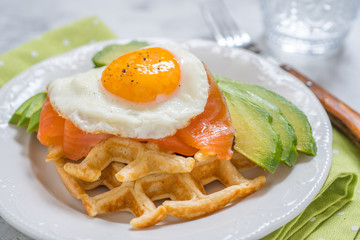 Healthy eating food breakfast oatmeal waffles, smoked salmon, avocado and egg