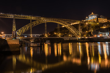Fototapeta na wymiar Night view of Porto with Dom Luis I Bridge, Duoro river and Mosteiro da Serra do Pilar