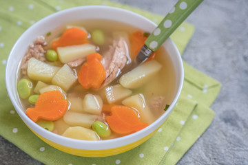 Tuna soup with vegetables in bowl