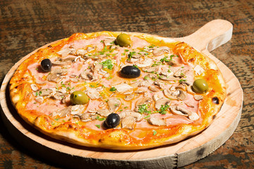Pizza with ham, mushrooms and olives