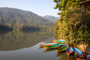 Colorful boats in Phewa lake in Pokhara, Nepal