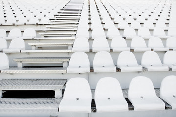 White plastic chairs in rows