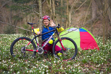 Fototapeta na wymiar Carbon mountain bicycle among flowers