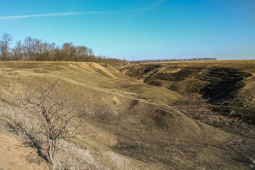 Fototapeta na wymiar Abandoned quarry for the extraction of brick materials near the village of novoselivka in the Kharkov region (Ukraine). 2007
