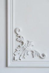 White wall molding with geometric shape and vanishing point. Luxury white wall design bas-relief with stucco mouldings roccoco element