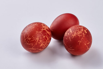 Eggs on white background. Dark red easter eggs. Symbol of spring holiday.