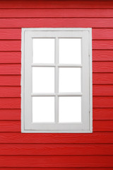 White window looking on red wood wall.