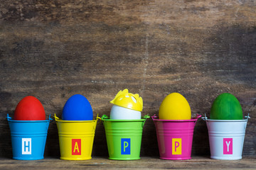 Easter eggs in colored buckets, selective focus image, Card Happy Easter 