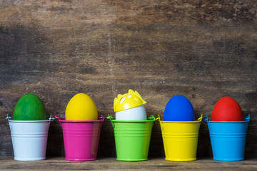 Easter eggs in colored buckets, selective focus image, Card Happy Easter 