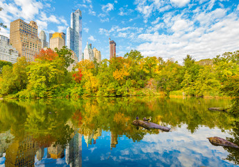 Central Park Autumn and buildings reflection in midtown Manhattan New York City