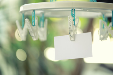 white paper notes hanging in a clothesline.