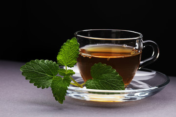 Herbal dry sri lanka tea. Mint leaf. Tea in a glass cup, mint leaves, dried tea, in a restaurant or teahouse