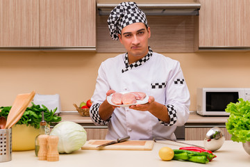 Young chef working in the kitchen